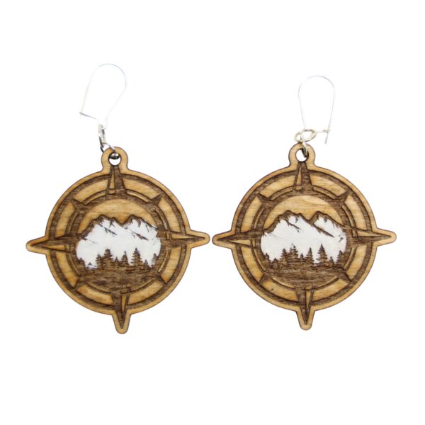 Mountain Compass Wood Earrings. These earrings are made with 1/8″ thickness basswood. These earrings are lightweight and hand painted. They are not sealed to keep a rustic look and feel.